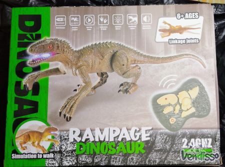 Dinossauro com telecomando novo em caixa.